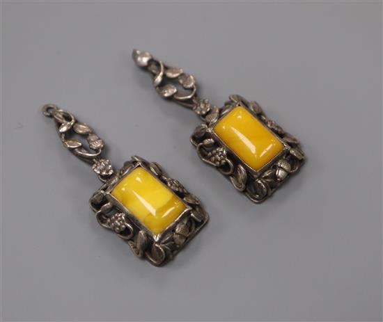 A pair of white metal and amber set drop earrings (lacking wires), 36mm.